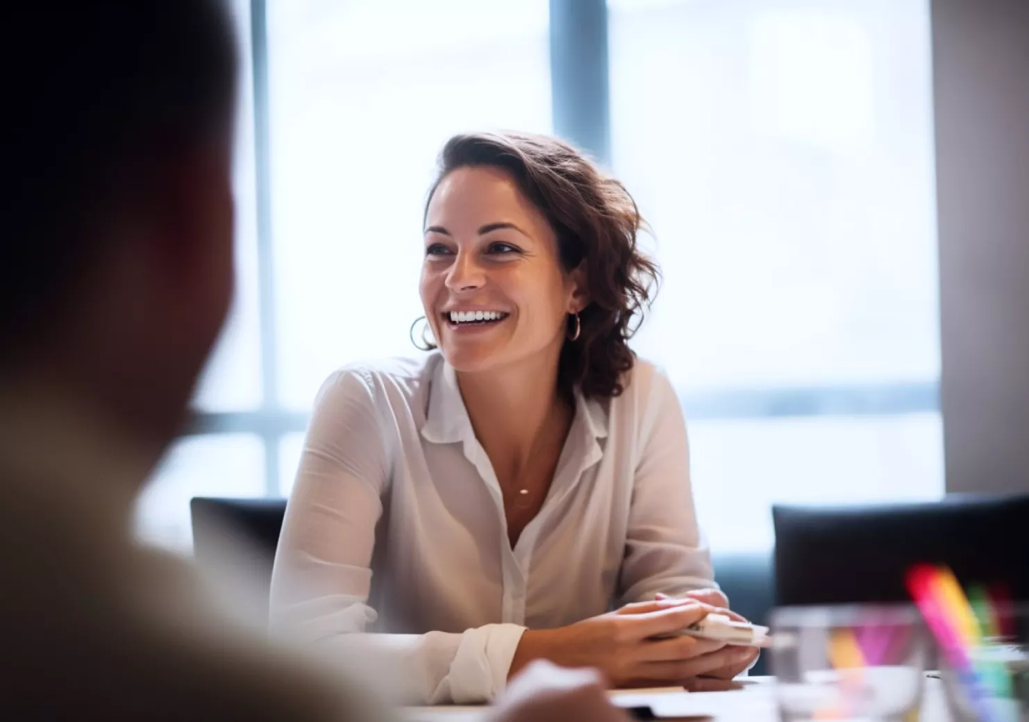 female employee smiling during meeting